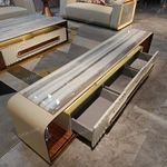 Architectural TV Stand with Sculpted Relief Panels Natural Wood Veneer Open Display Shelves and Soft Ambient Lighting